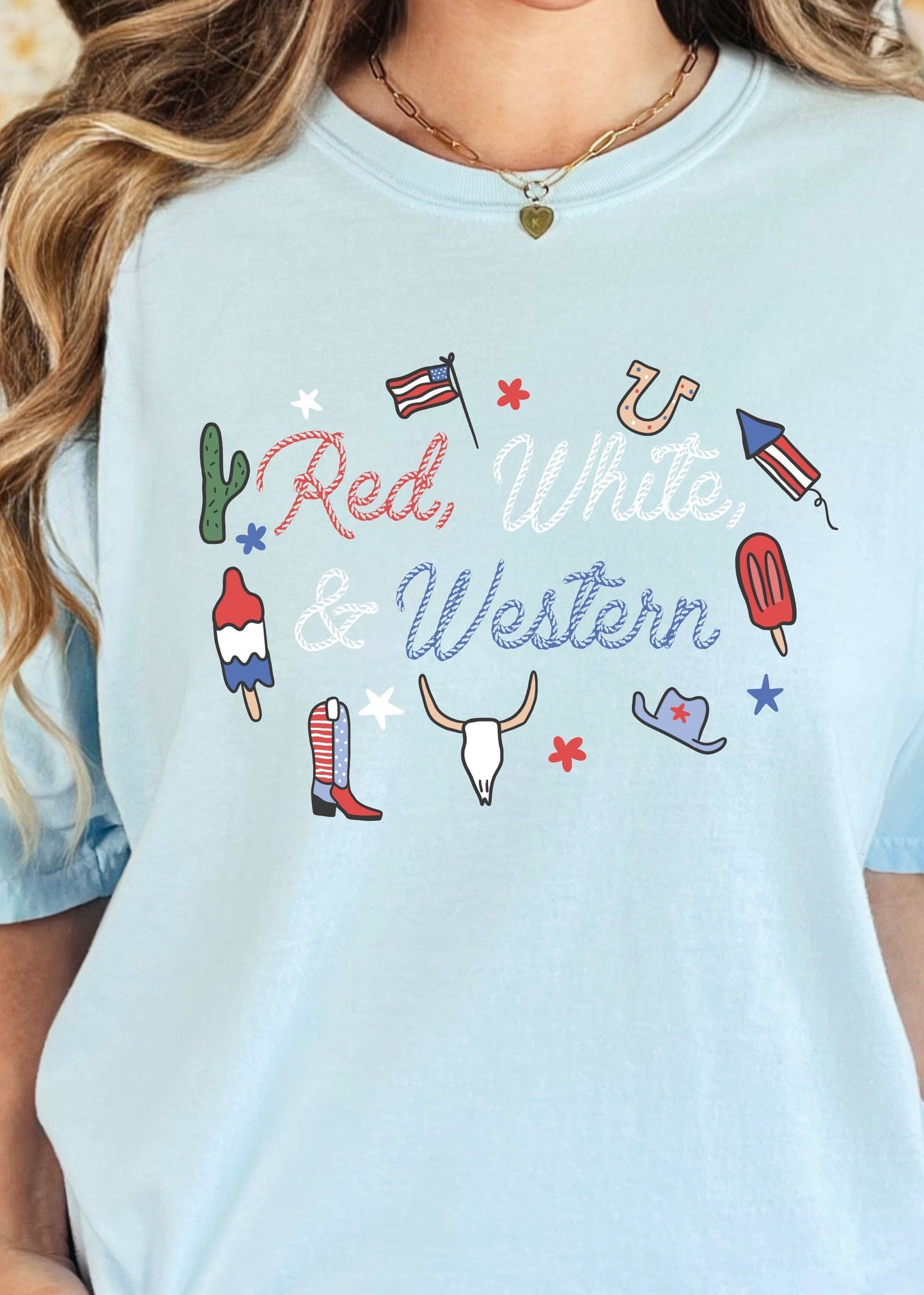 Light blue t-shirt with 'Red, White & Western' text and graphics worn by a person.