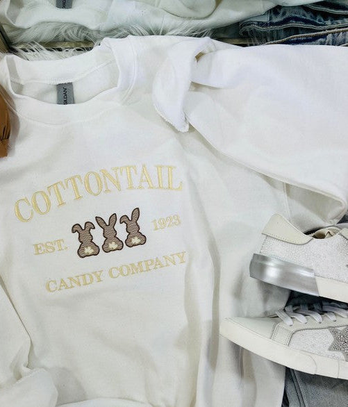 White sweatshirt with 'Cottontail Candy Co. est.