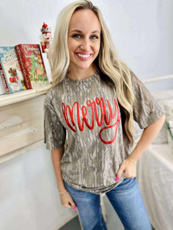Woman wearing a 'Merry' shirt in a casual setting
