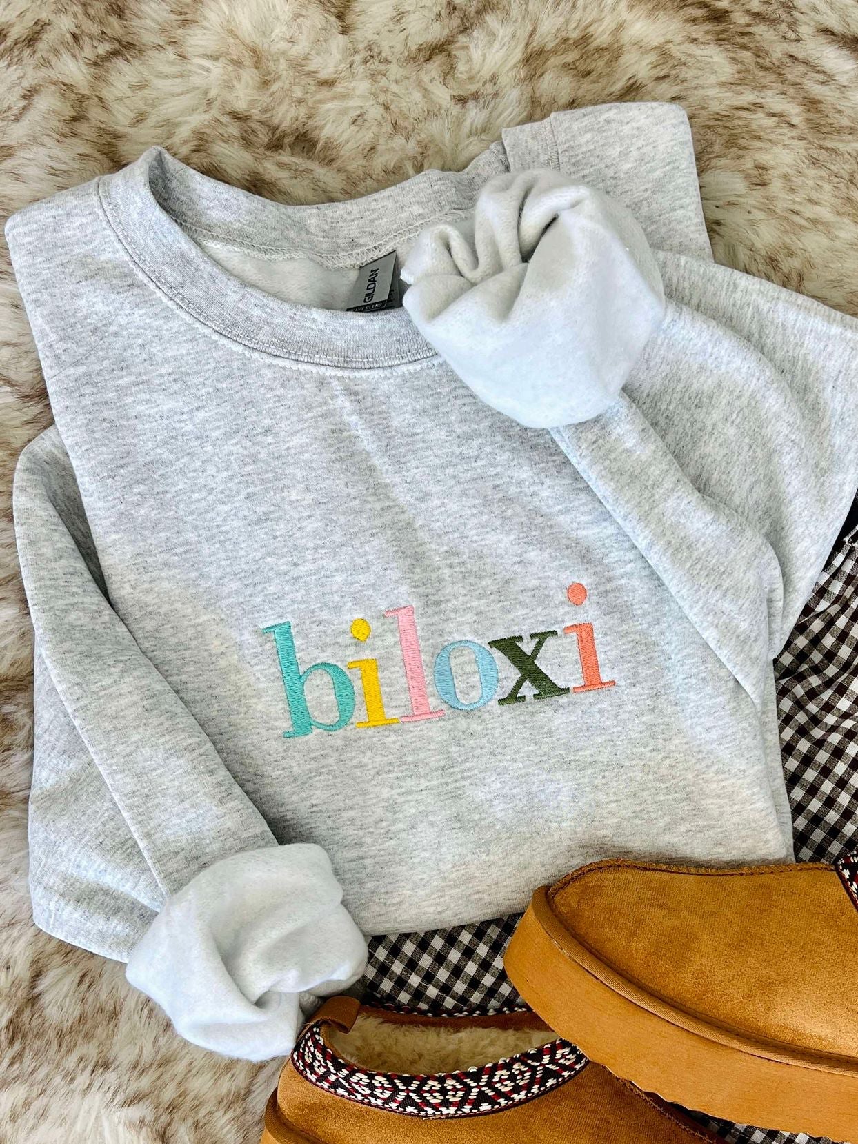 Ash sweatshirt with "Biloxi" on it in Muti color rainbow thread