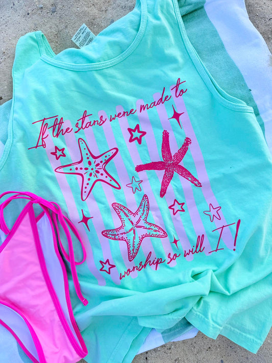 Mint green tank top with pink starfish design and text, paired with a pink bikini bottom on a concrete surface.